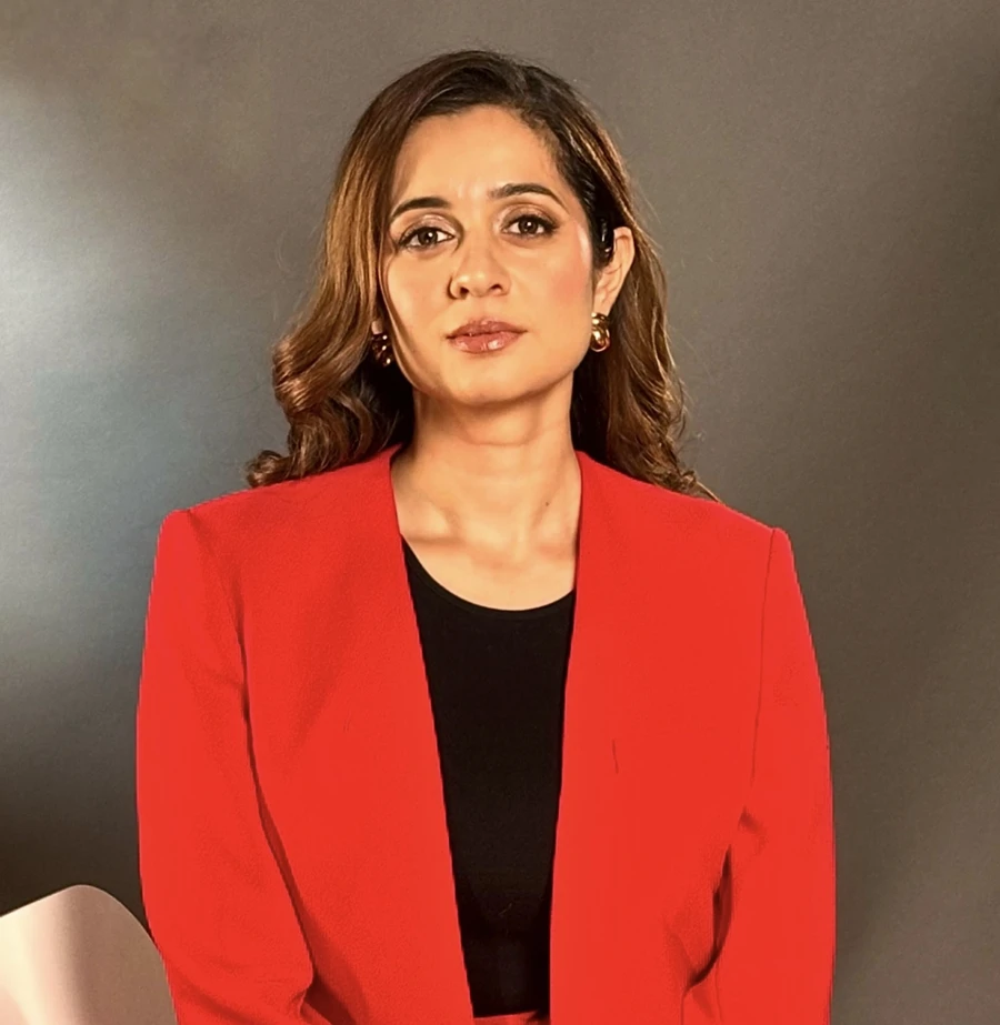 Mansha Arora wearing a red jacket